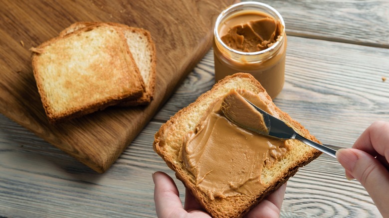 making peanut butter sandwich