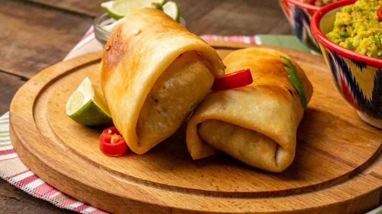 chimichangas on wooden plate