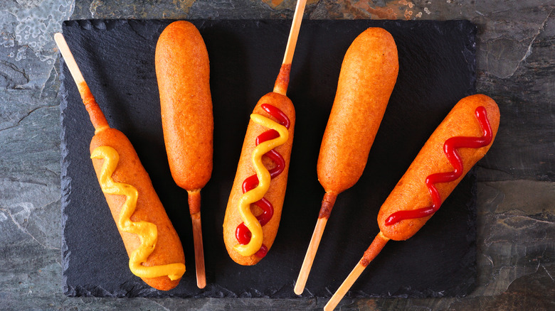 corn dogs with various toppings