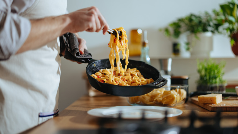 person serving pasta