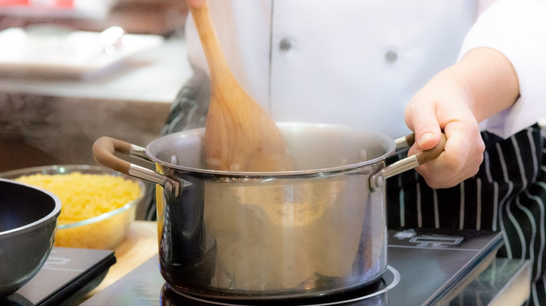 stirring pot of hot food