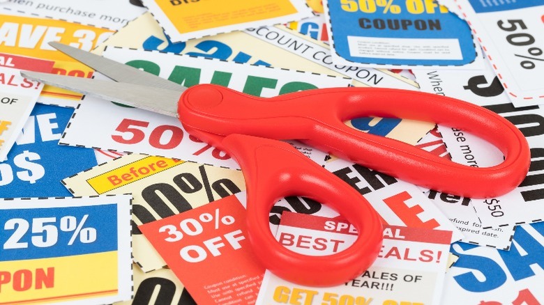 pile of coupons with scissors