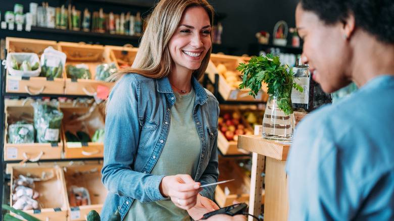 woman paying with credit card