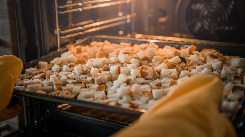 tray of croutons in oven