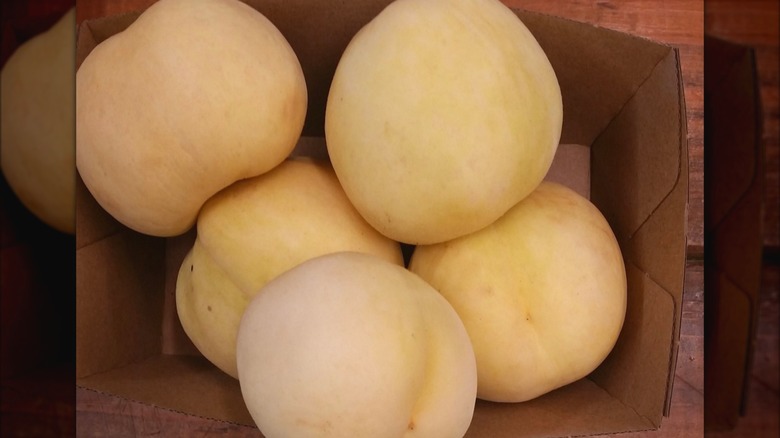 White peaches in a box