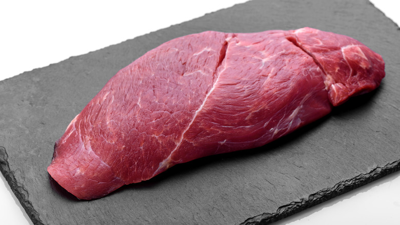 chuck roll steak on cutting board