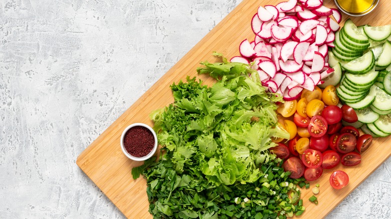 Cut up vegetables on board