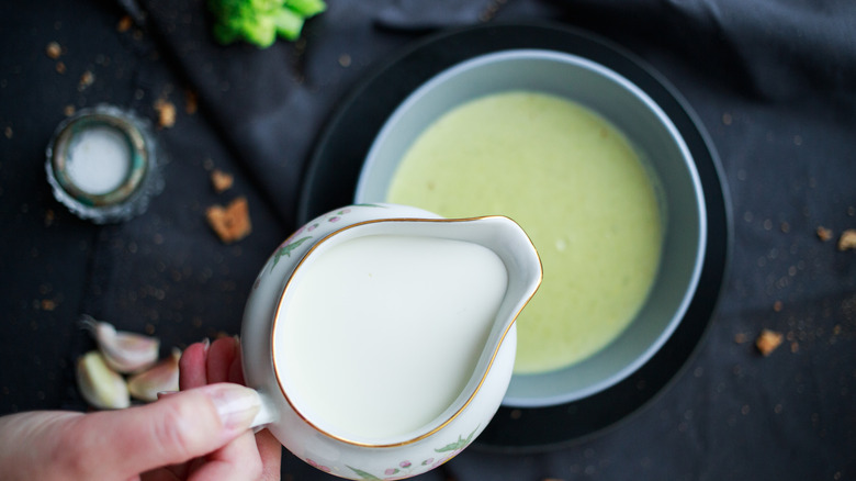 Pouring cream into soup