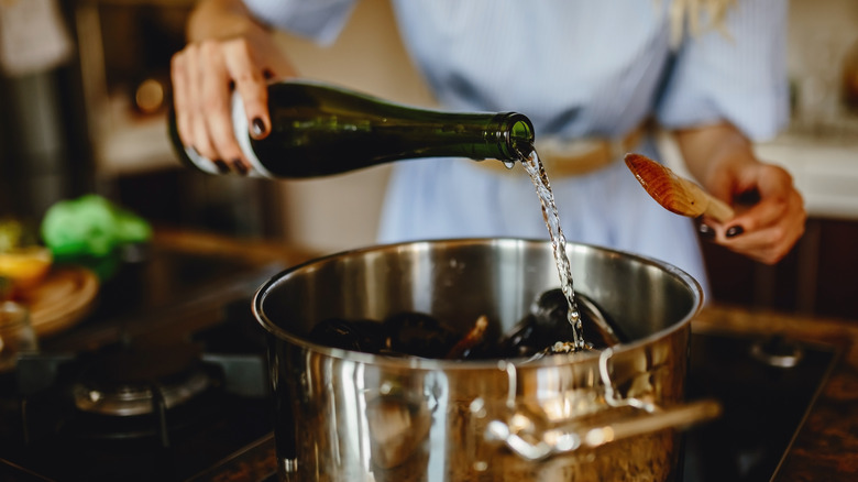 Adding wine to a pot