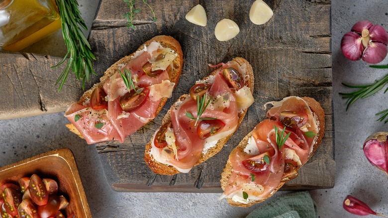 Prosciutto toast on wooden board