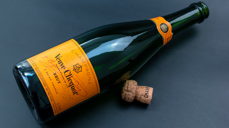 Open bottle of Veuve Clicquot Brut Yellow Label lying on its side