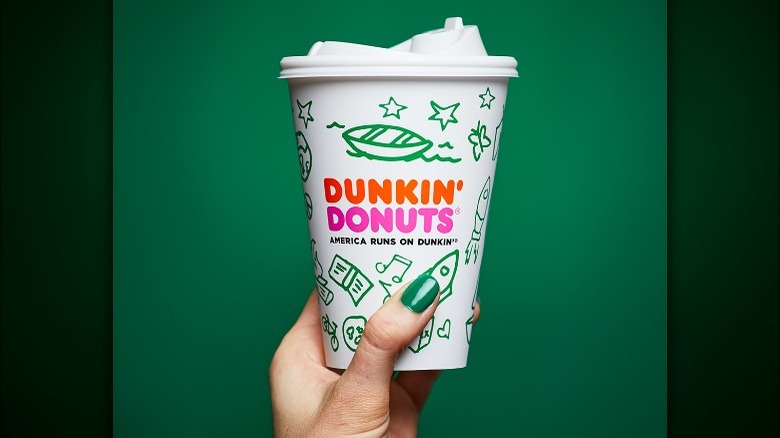 Dunkin Donuts girl scouts cup with green background