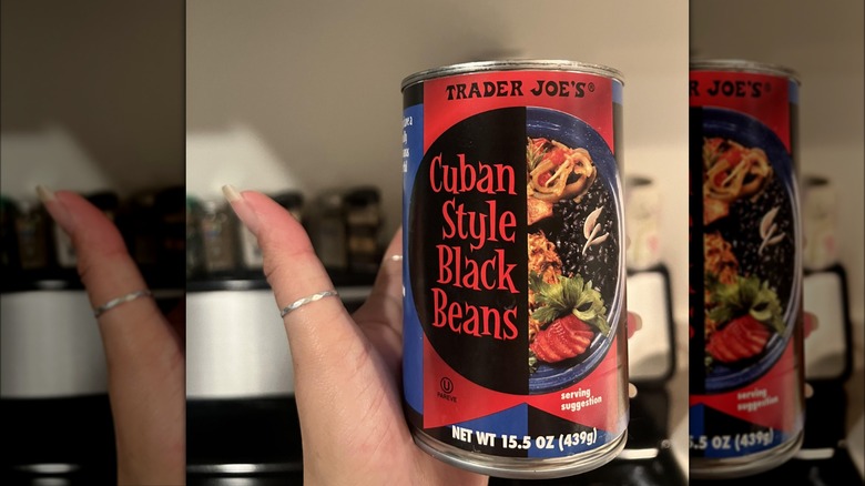 hand holding TJ's black beans