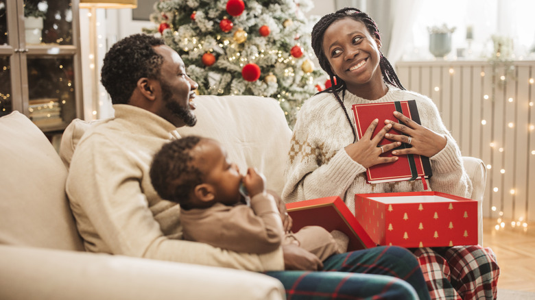 family opening holiday presents