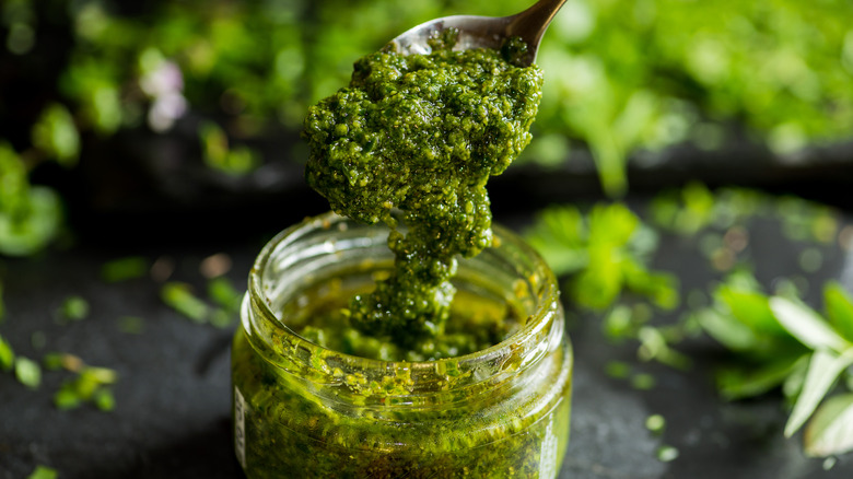 green pesto jar and spoon