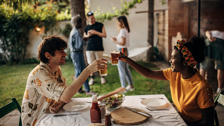 two people sitting at picnic table