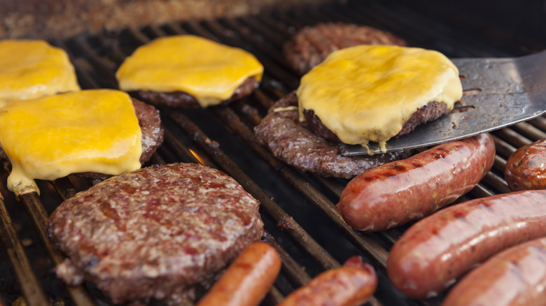 hot dogs and hamburgers on grill