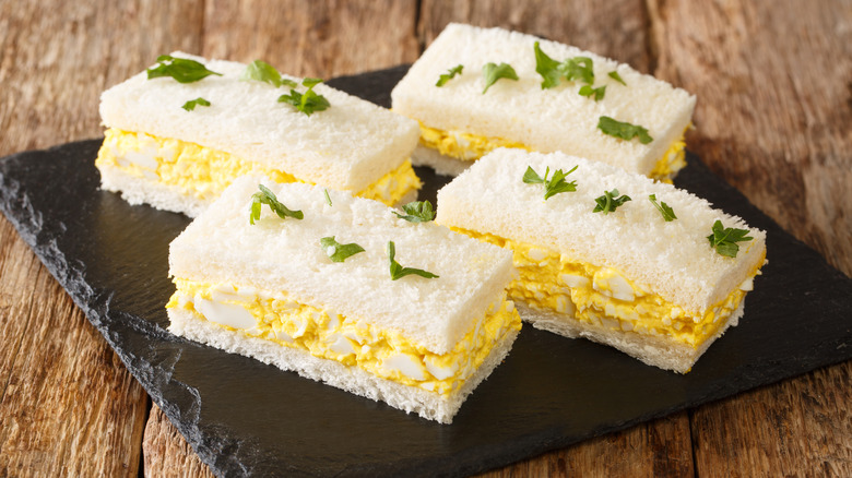 Egg salad sandwiches on stone