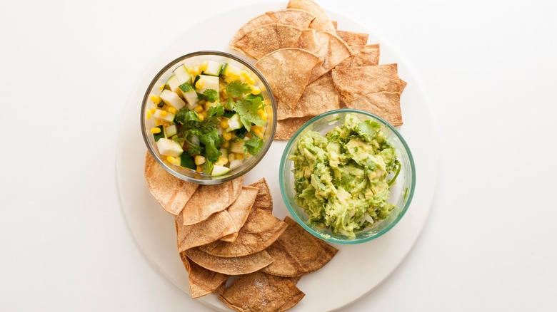 Chips with zucchini salsa and guacamole
