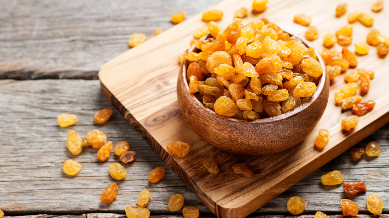 Overflowing bowl of golden raisins