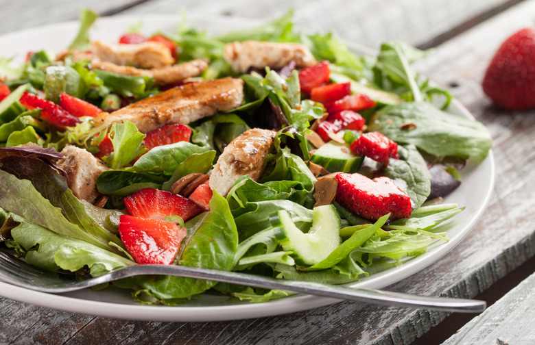 Roasted Chicken on Spinach With Strawberries, Caramelized Pecans, and Balsamic Dressing