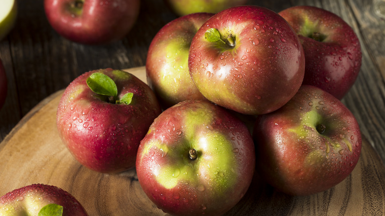 mcintosh apples on wooden board