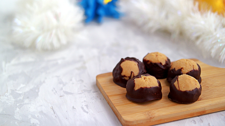 Buckeye candies on wooden board