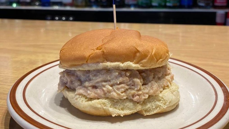 Shredded chicken sandwich on plate