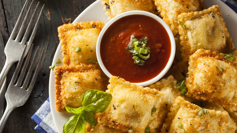 Fried ravioli plate with sauce