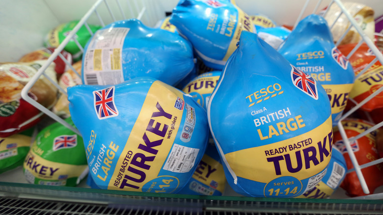 Turkeys in grocery freezer box