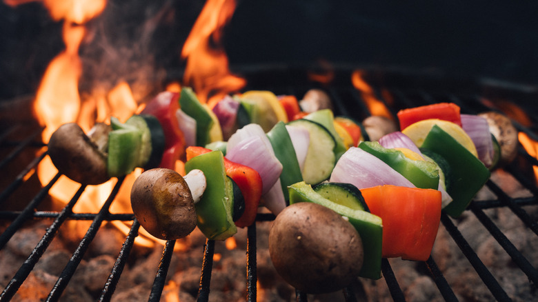 vegan skewers on grill with high flame