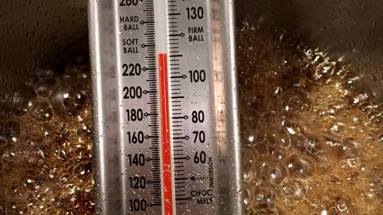 thermometer in pot of boiling sugar