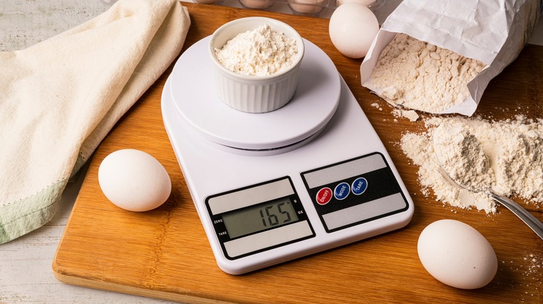 kitchen scale with flour and eggs