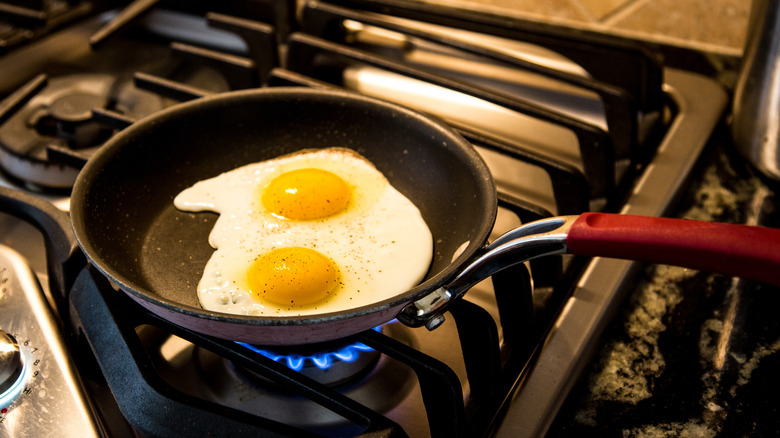eggs cooking in nonstick pan