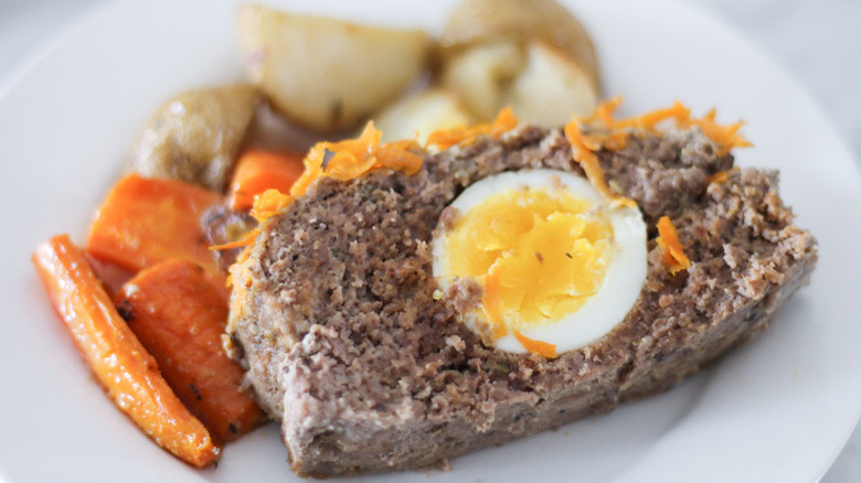 egg-stuffed meatloaf slice on plate