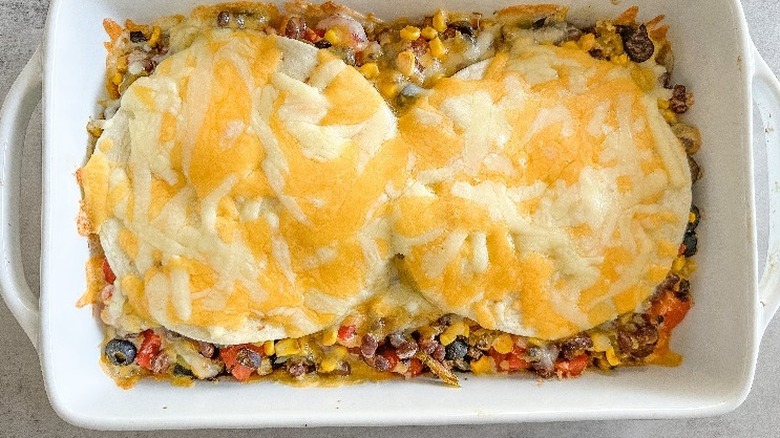Tray of taco bake with melted cheese