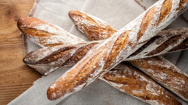 Flour crusted bread on table