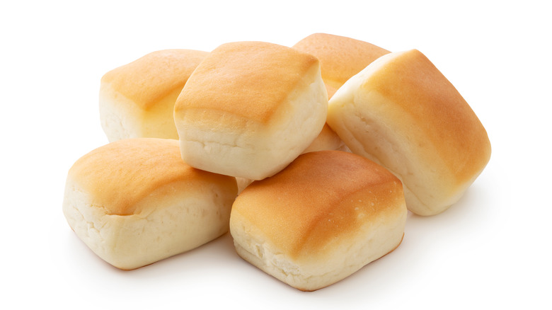 Golden dinner rolls in pile