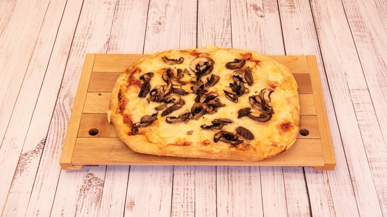 Mushroom focaccia on wooden board