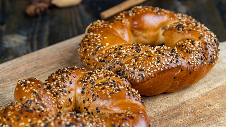 Sesame seed bagels on board