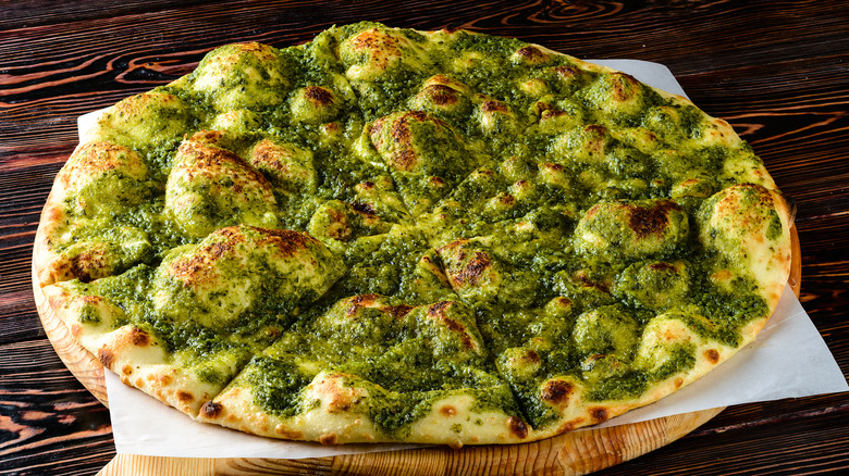 Pesto crusted focaccia on table