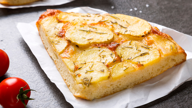 Potato focaccia on black slab