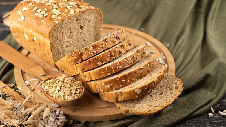 Oat crusted bread on wood