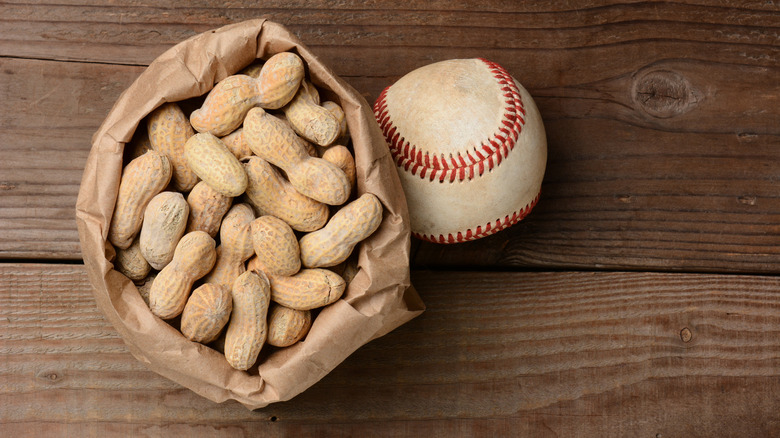 A bag of peanuts and a baseball.