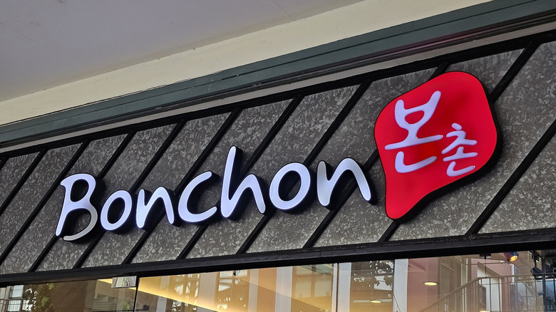 A red and white sign for Bonchon chicken