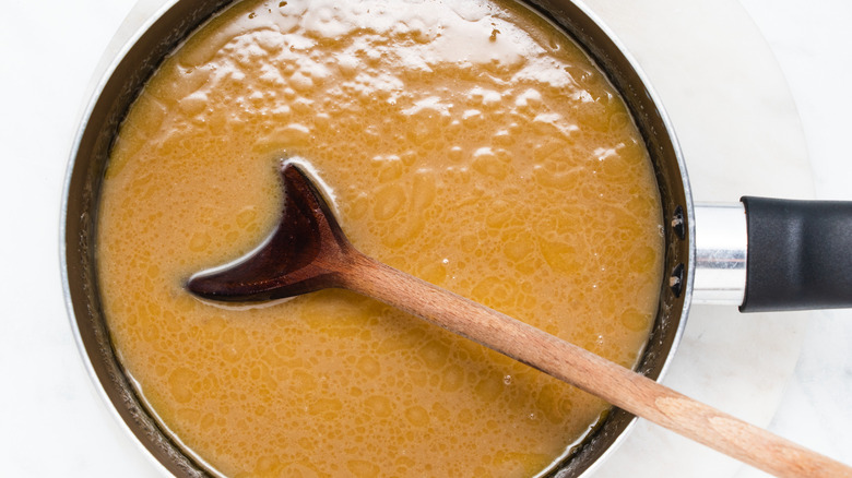 brown liquid in saucepan