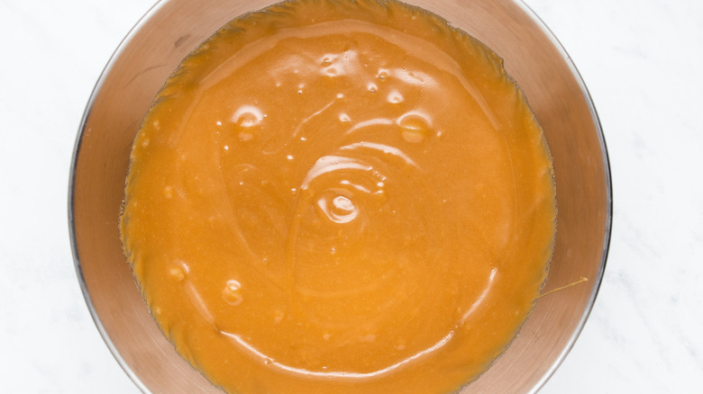 brown liquid in mixing bowl 