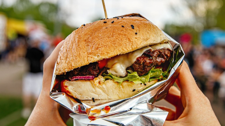 Street food hamburger with cheese and lettuce