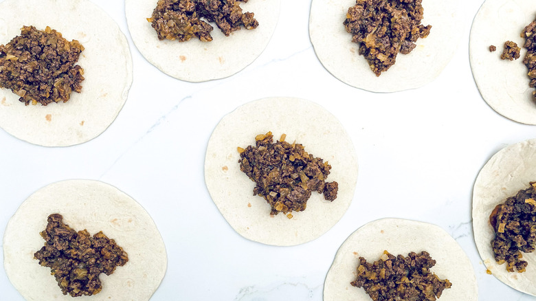 ground beef mixture in tortillas