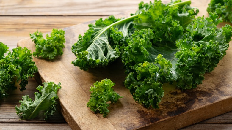 Curly kale on cutting board